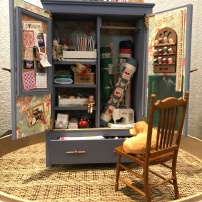 Barbara Adams's 1:12 scale cupboard is full of sewing notions.